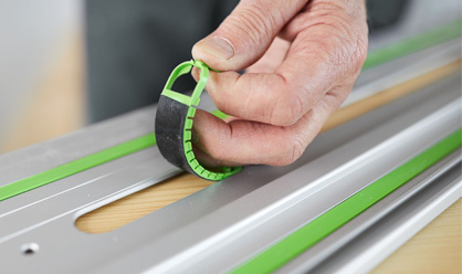 The adhesive pads are quick and easy to install in the guide rail cut-outs